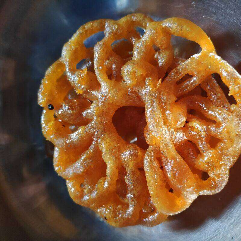 Freshly made, syrupy jalebi served hot